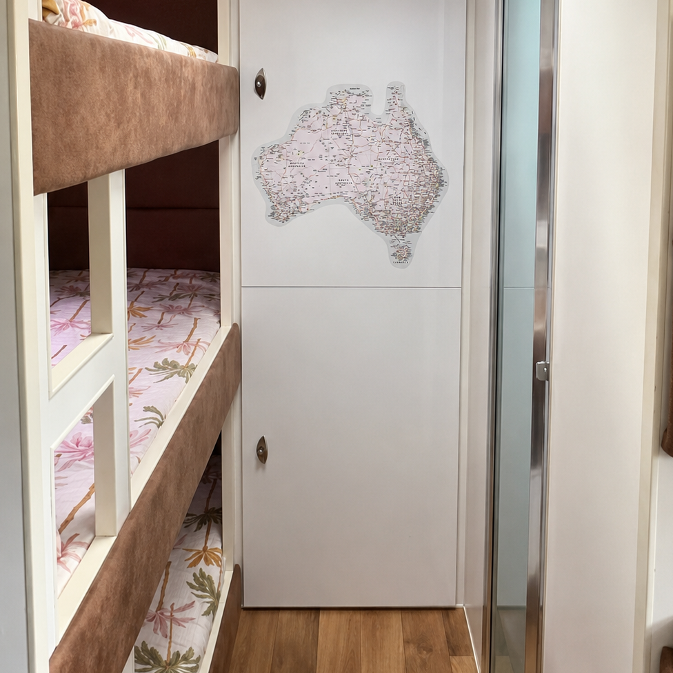 A map of Australia decal, shown next to the bunk beds in a caravan.
