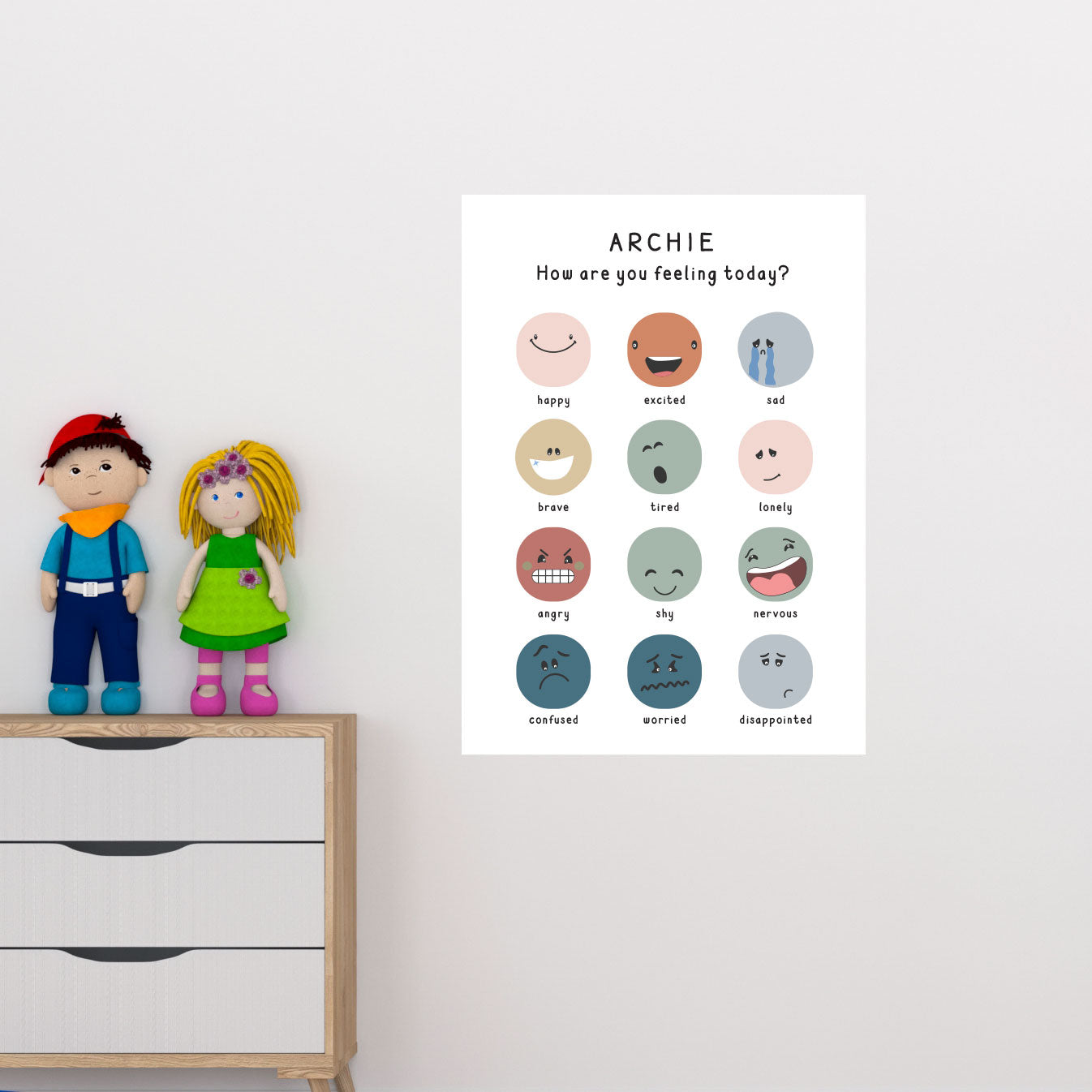A wall decal featuring various emotion icons, such as smiling and frowning faces, displayed on a wall with a wooden cabinet and a plush toy to the left.